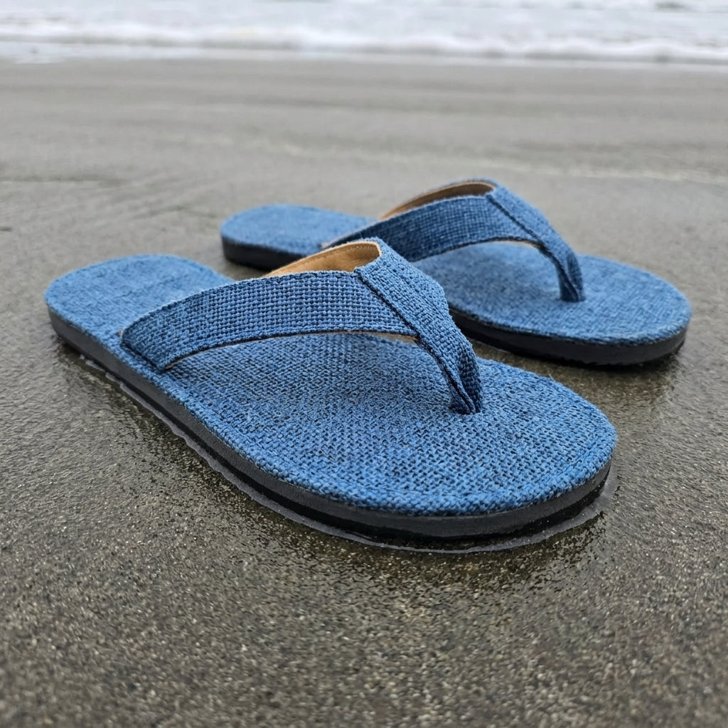 Blue Dye Hemp Flip Flops Vegan Plastic-Free Summer Sandals Handmade Hemp Slippers on a sandy beach