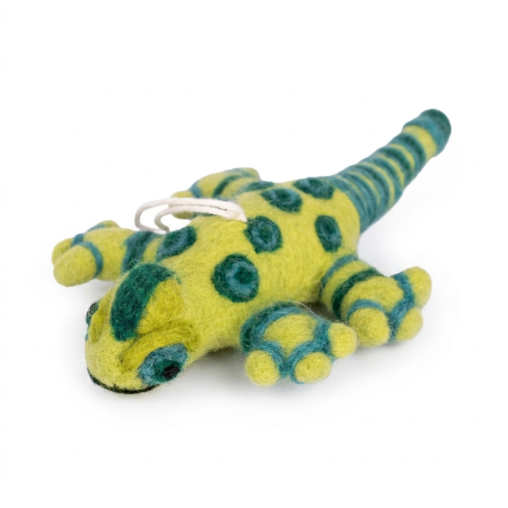 Handmade wool felt lizard ornament with hanging thread on a white background
