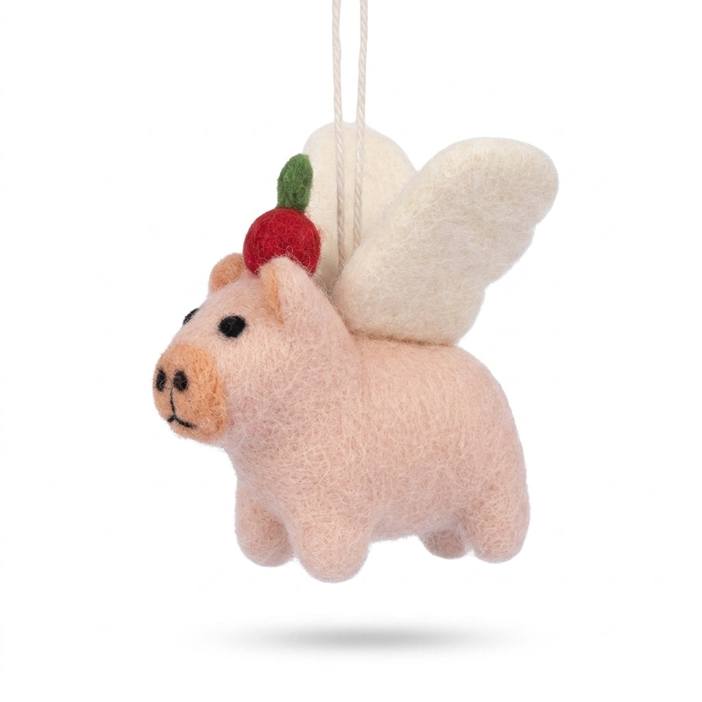 Handmade wool felt poodle dog ornament with classic grooming detailst with butterfly wings and strawberry on a white background