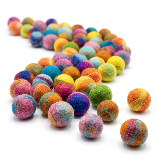 Multicolored felt balls on a white background