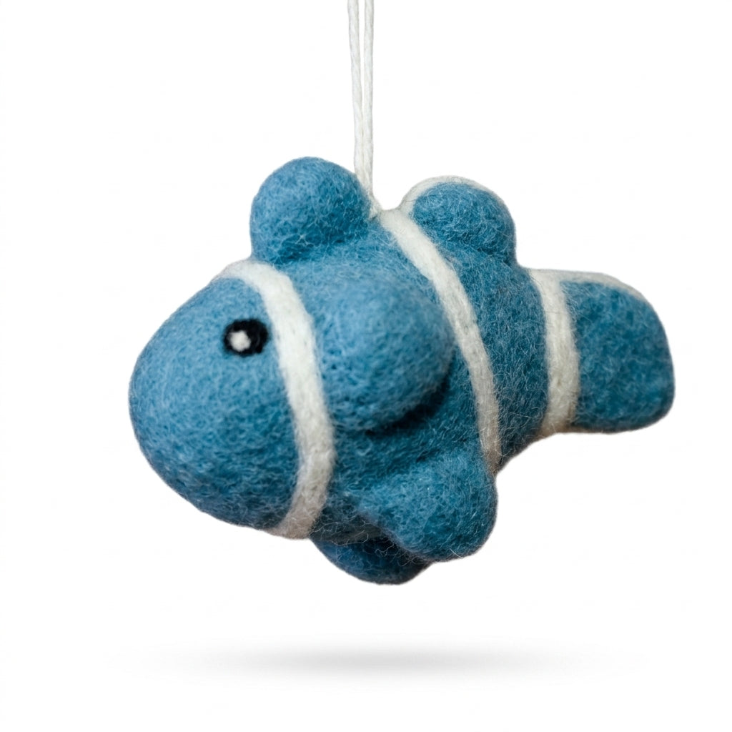 Blue fish-shaped ornament with white stripes on a white background