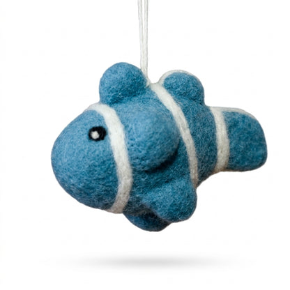 Blue fish-shaped ornament with white stripes on a white background