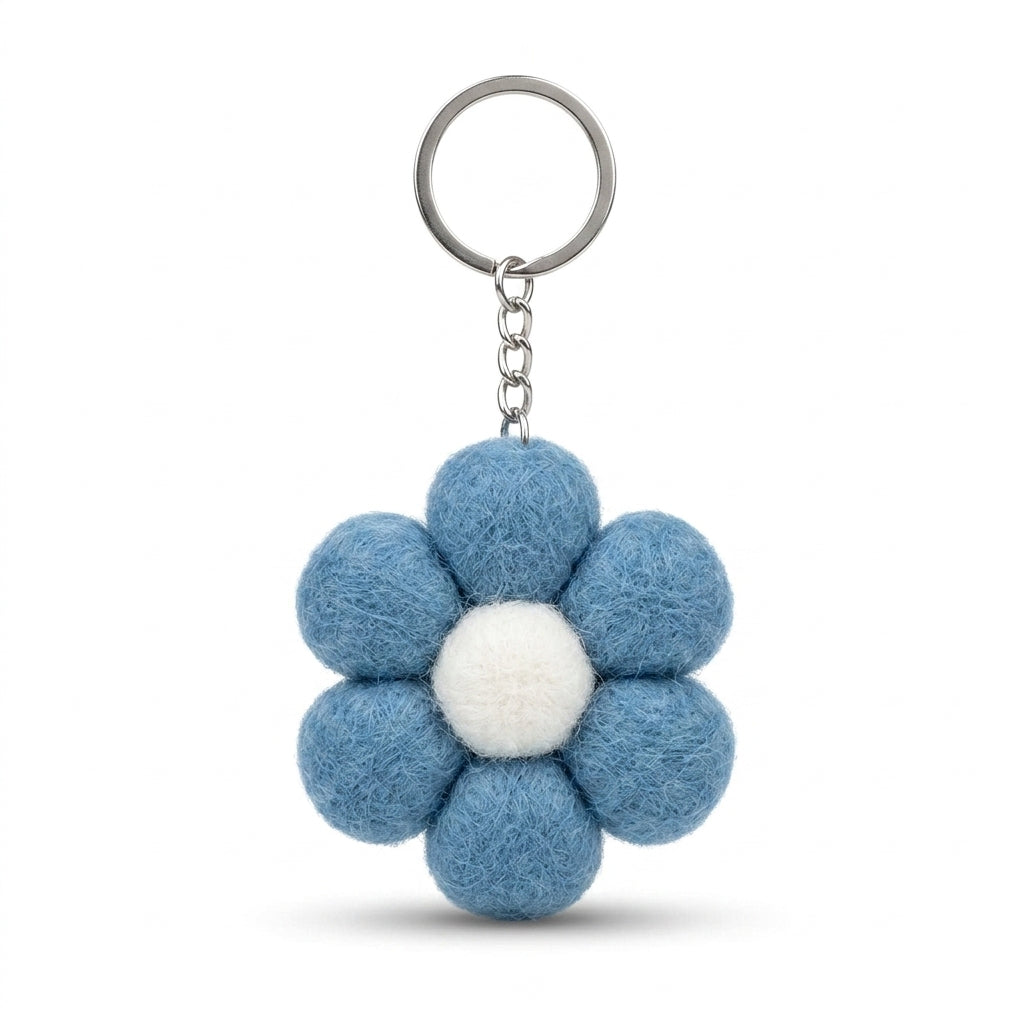 Blue wool felt large flower keyring with white centre  on a white background