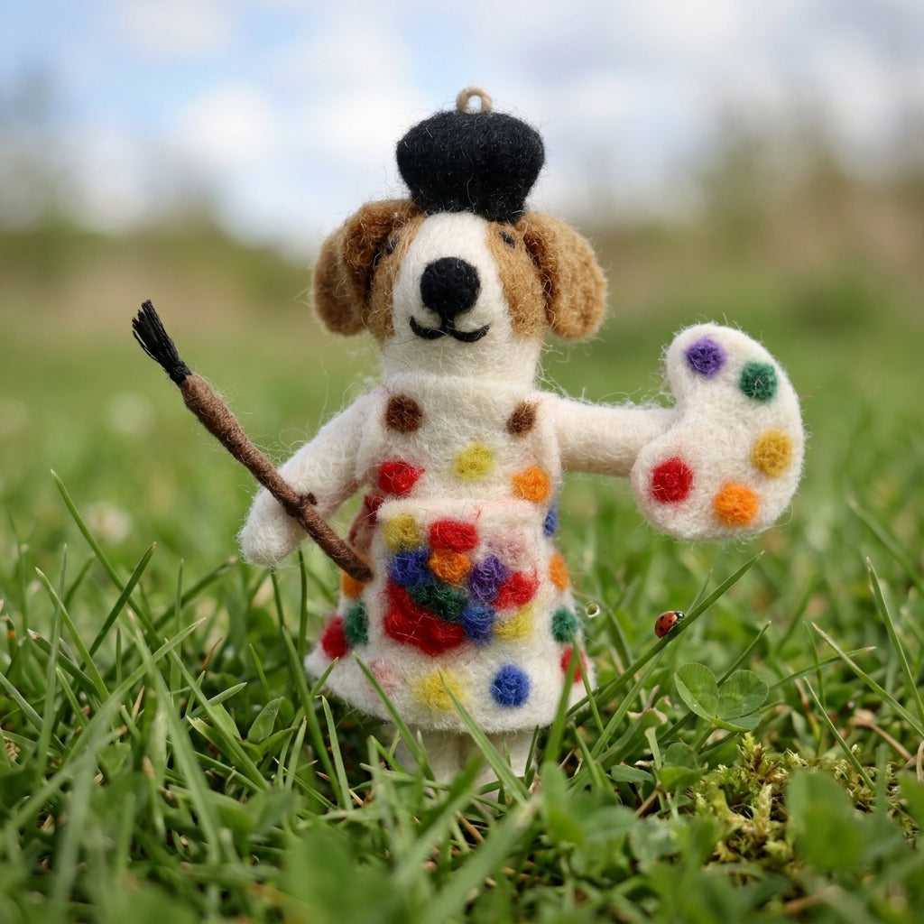Decorative ornament of a dog in a colorful dress in grass