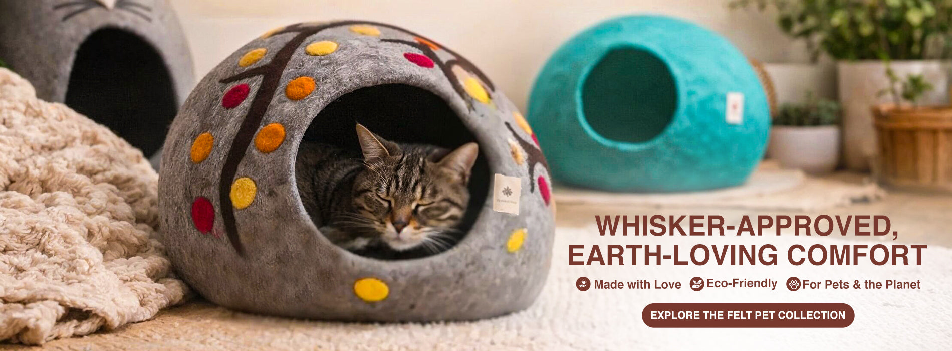 Cat in a felt pet bed with 'Whisker-Approved, Earth-Loving Comfort' text