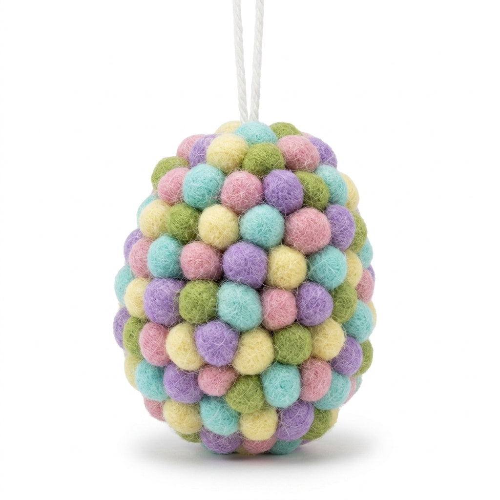 Handmade wool felt ball egg ornament with pastel colours on a white background