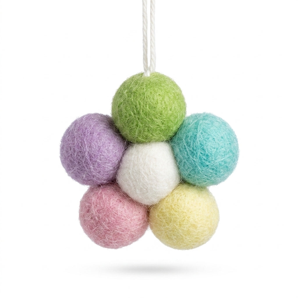 Colorful felt ball flower decoration on a white background