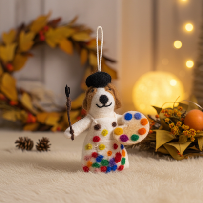 Handmade wool felt painter dog ornament , against a warm-toned background.