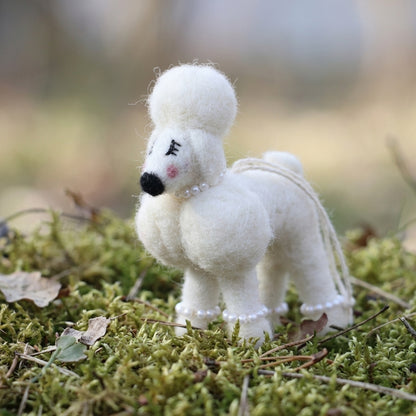 Handmade wool felt poodle dog ornament  on a grassy background