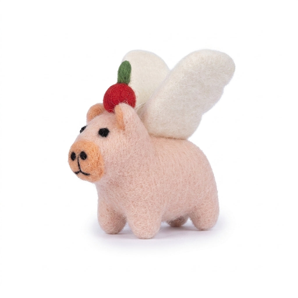 Handmade wool felt poodle dog ornament with classic grooming details with a strawberry on its head against a white background