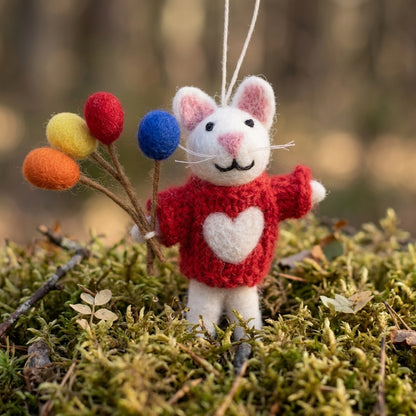 Mouse with balloons felt ornament for birthday gift with a red sweater and colorful balloons on a natural background