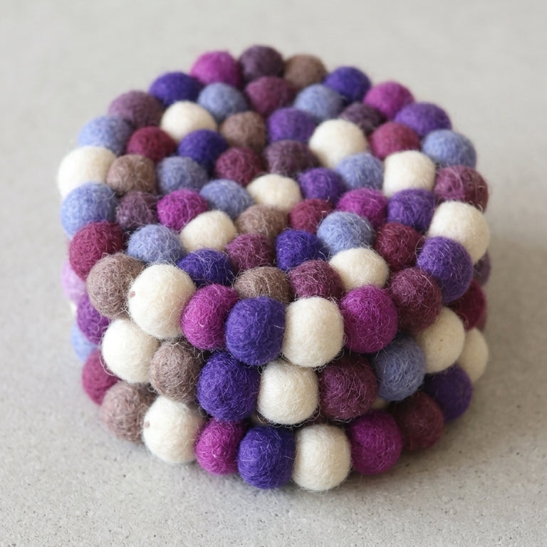 Plum Violet Purple wool felt coasters handmade in Nepal, jewel tone absorbent non-scratch drink coasters for wooden tables, tea lover gifts, host gifts and new home buyersSTACKED on a light gray background
