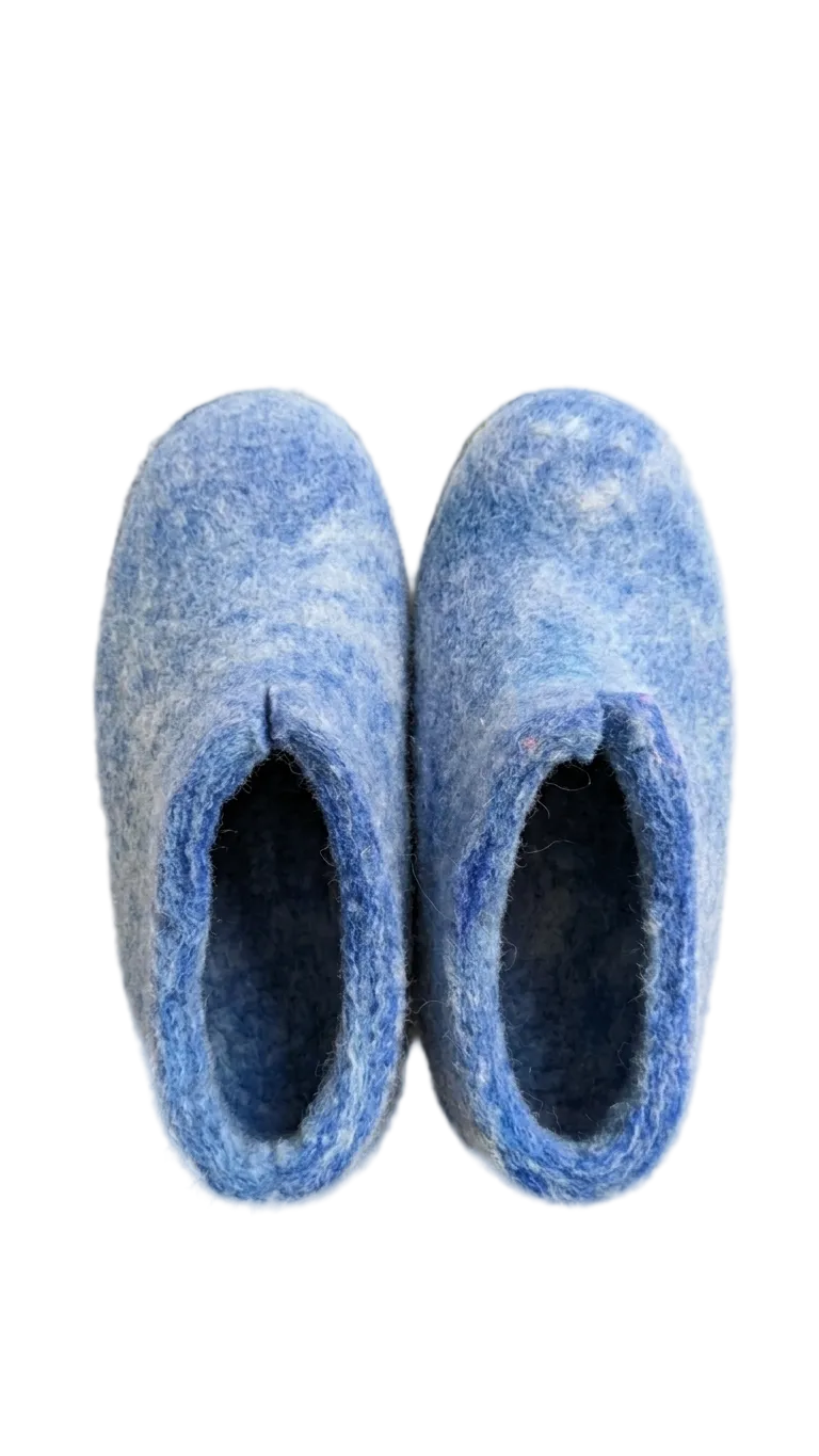 Pair of blue slippers on a white background