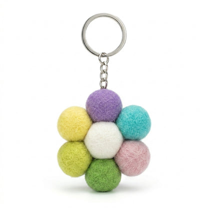 Pastel wool felt large flower keyring in mixed colours with a metal ring on a white background