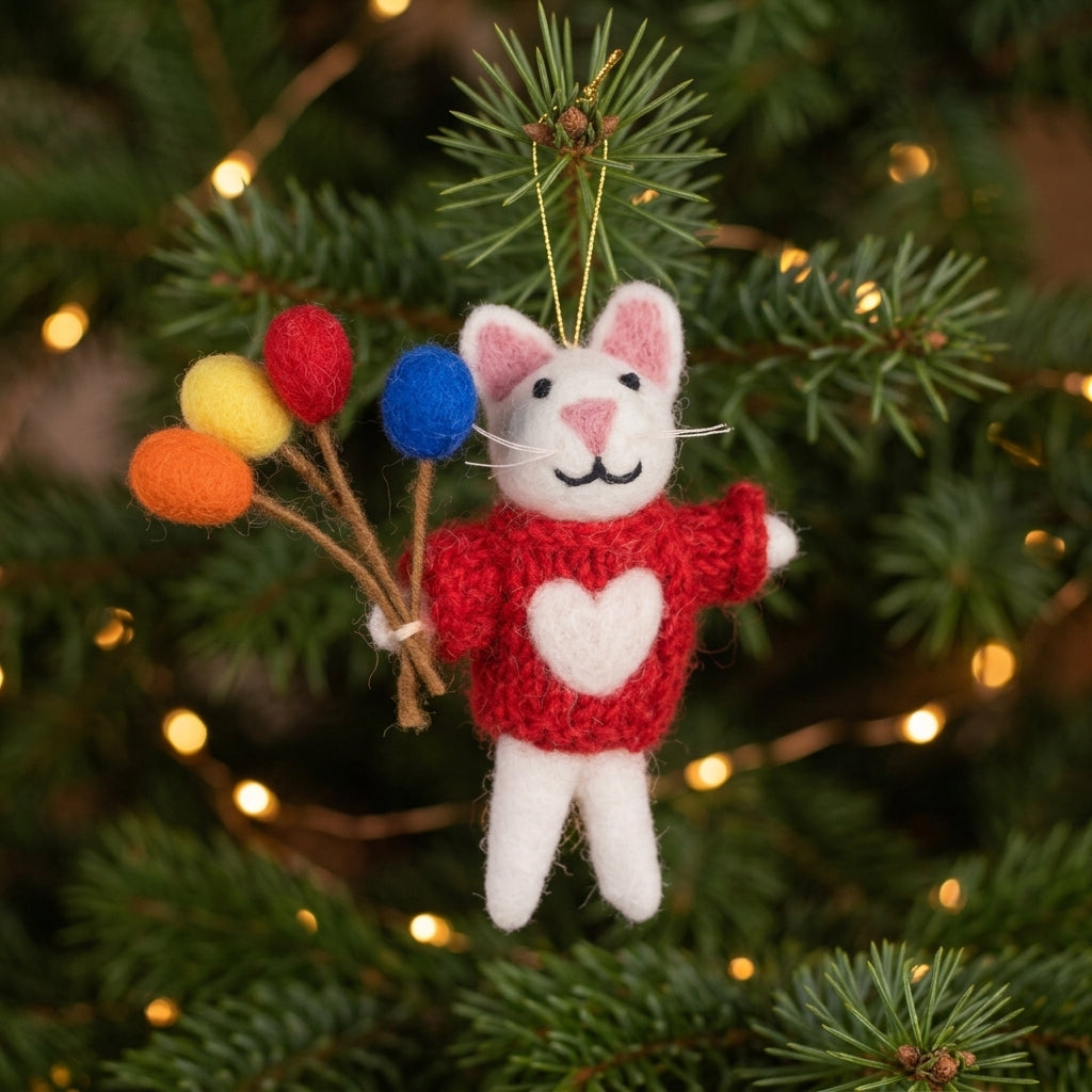 White wool felt mouse ornament holding colourful balloon with colorful balloons on a Christmas tree.