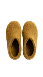 Pair of mustard yellow slippers on a white background